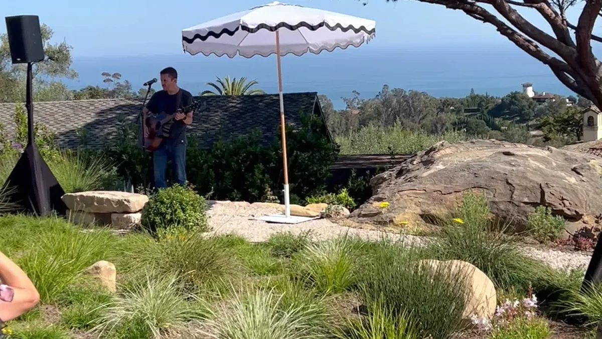 Wide view of the Glen Phillips private performance and audience in Montecito