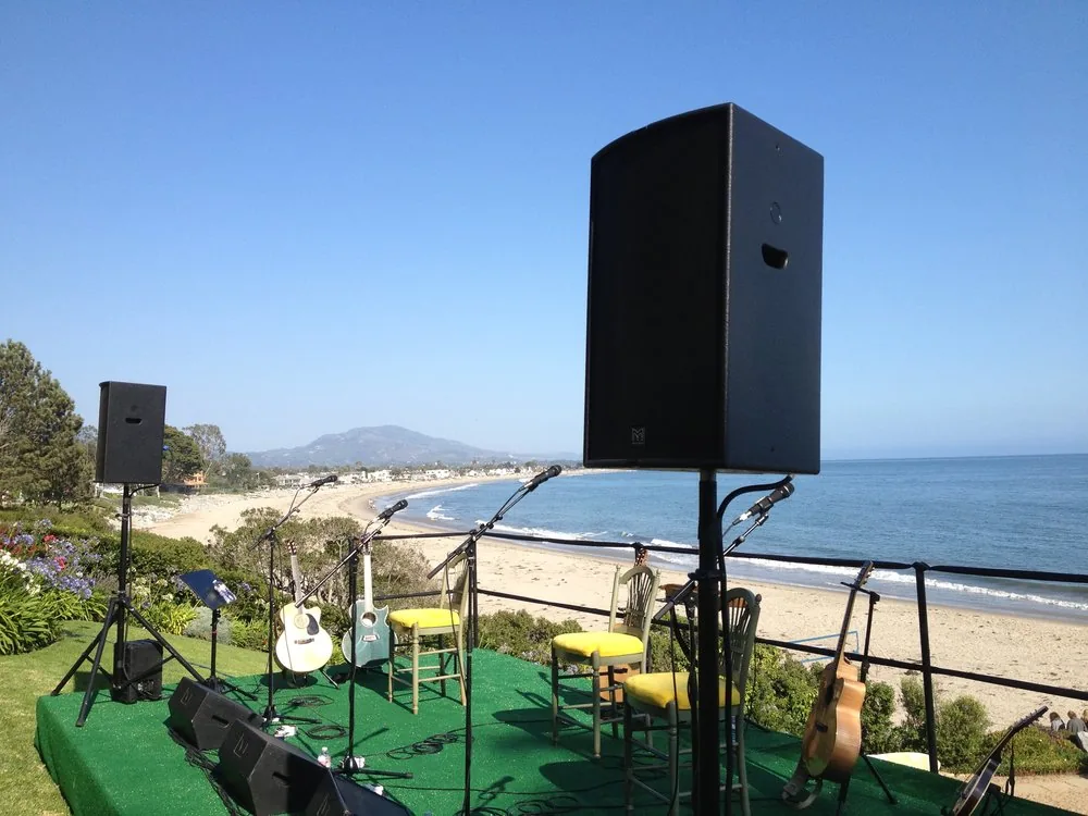 Professional loudspeakers, microphones and instruments arranged for an oceanfront private event in Montecito